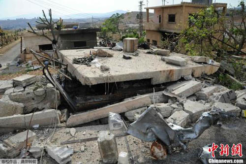 資料圖：當?shù)貢r間5月5日凌晨。以色列對3處敘利亞軍事場所進行空襲，造成平民傷亡和大規(guī)模破壞，空襲威脅